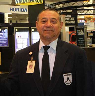 Photo 
                        of a smiling Maloney Security Officer guarding the Moscone exhibitions